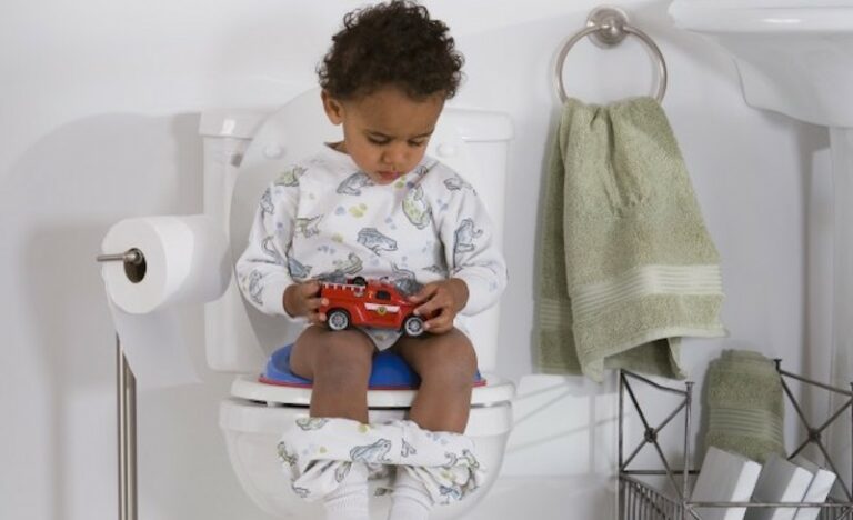 potty training boy sitting on potty toilet